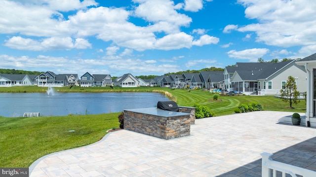 18234 Highwood Dr, Rehoboth Beach, DE 19971 - view of patio / terrace featuring a residential view, a grill, and a water view