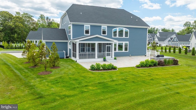18234 Highwood Dr, Rehoboth Beach, DE 19971 - back of property with a patio, a sunroom, and a yard