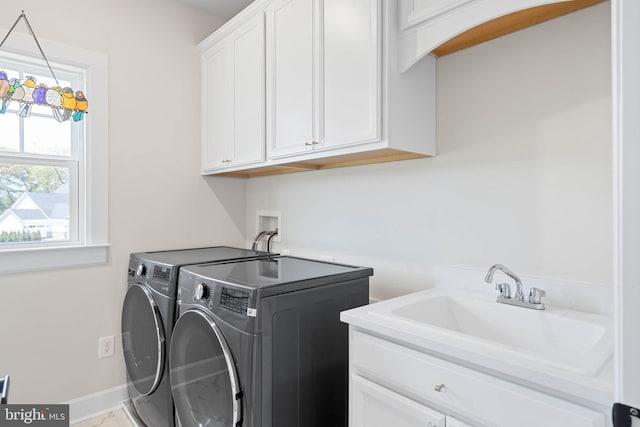 18234 Highwood Dr, Rehoboth Beach, DE 19971 - washroom with cabinet space, washing machine and clothes dryer, and baseboards