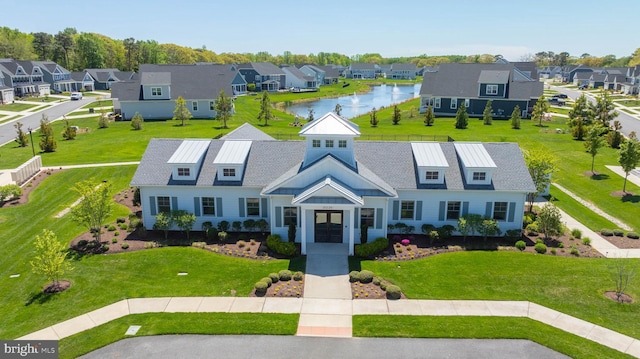 18234 Highwood Dr, Rehoboth Beach, DE 19971 - view of front of house featuring a residential view, a water view, and a front yard