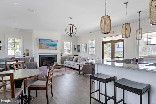 18234 Highwood Dr, Rehoboth Beach, DE 19971 - dining area with plenty of natural light, ornamental molding, a fireplace, dark wood finished floors, and recessed lighting