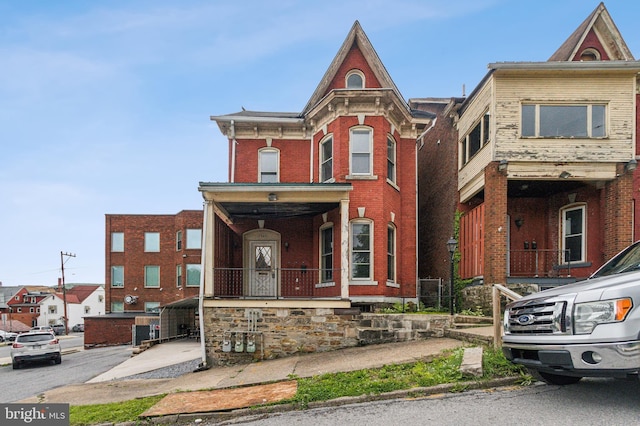 1305 14th Ave, Altoona, PA 16601 - view of front facade featuring brick siding and a porch