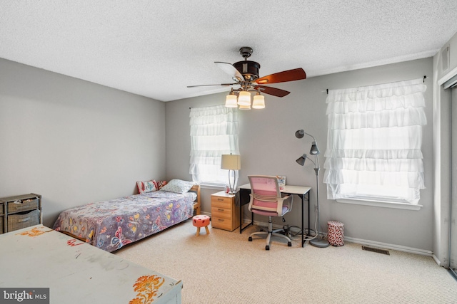 101 Pear Tree Ln, Franklin Park, NJ 08823 - bedroom with carpet floors, a textured ceiling, a ceiling fan, and baseboards