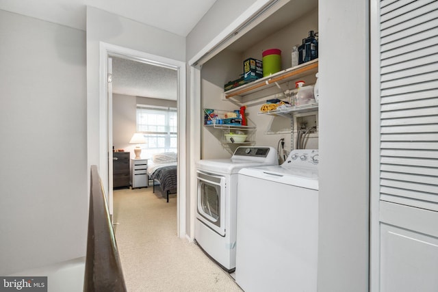 101 Pear Tree Ln, Franklin Park, NJ 08823 - laundry room with washer and clothes dryer and light colored carpet