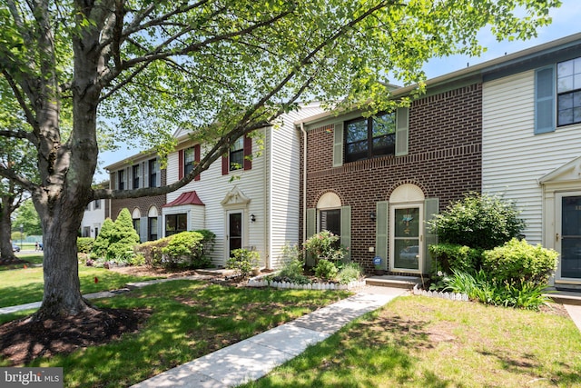 101 Pear Tree Ln, Franklin Park, NJ 08823 - view of front facade with a front lawn and brick siding