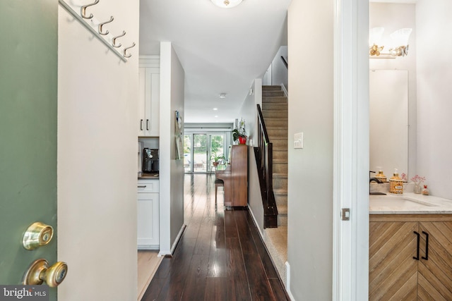 101 Pear Tree Ln, Franklin Park, NJ 08823 - hall featuring stairs, dark wood-style flooring, and a sink