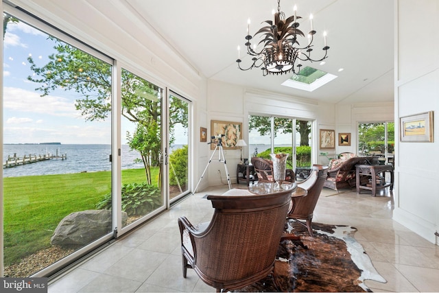 9791 Pintail Pl, Saint Michaels, MD 21663 - sunroom / solarium featuring a water view, healthy amount of natural light, tile patterned flooring, a chandelier, and lofted ceiling