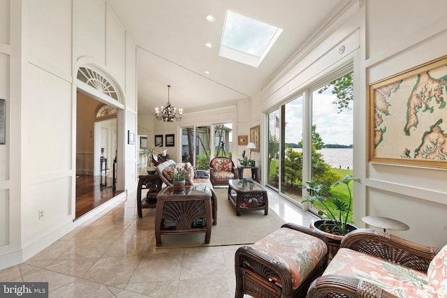 9791 Pintail Pl, Saint Michaels, MD 21663 - sunroom / solarium featuring vaulted ceiling, a skylight, a chandelier, and a water view