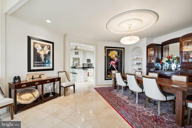 9791 Pintail Pl, Saint Michaels, MD 21663 - dining space with crown molding, built in shelves, ceiling fan, recessed lighting, and light tile patterned flooring