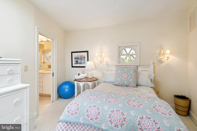 9791 Pintail Pl, Saint Michaels, MD 21663 - bedroom featuring carpet floors, ensuite bathroom, and baseboards