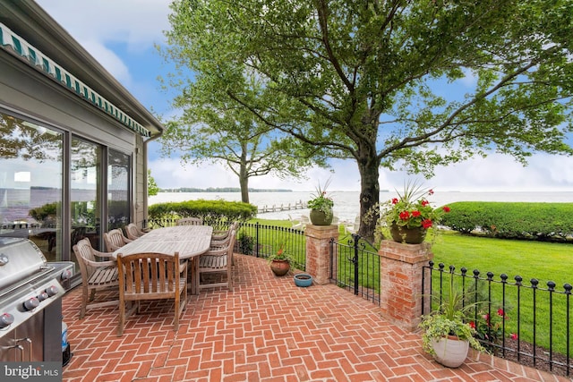 9791 Pintail Pl, Saint Michaels, MD 21663 - view of patio with a water view, a grill, and outdoor dining space