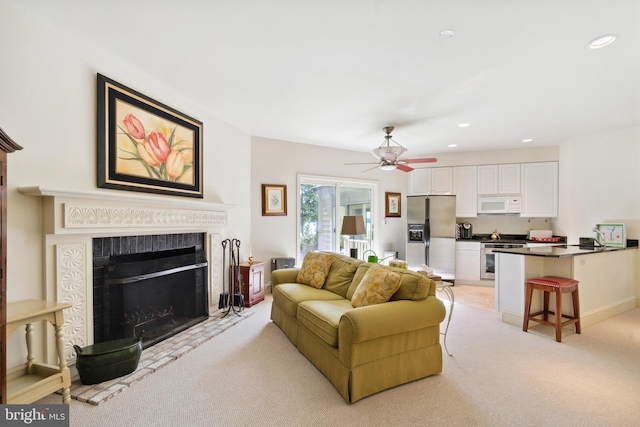 9791 Pintail Pl, Saint Michaels, MD 21663 - living area with light carpet, a fireplace, recessed lighting, and ceiling fan