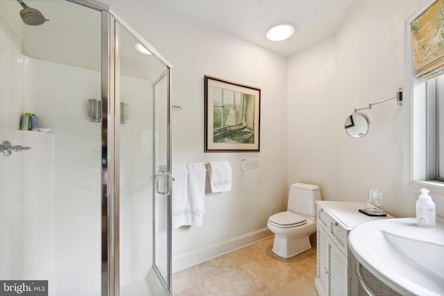 9791 Pintail Pl, Saint Michaels, MD 21663 - full bath with a shower stall, vanity, baseboards, toilet, and tile patterned flooring