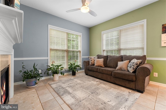 4000 Timber Oak Trl, Fairfax, VA 22033 - tiled living area featuring ceiling fan, a warm lit fireplace, and baseboards