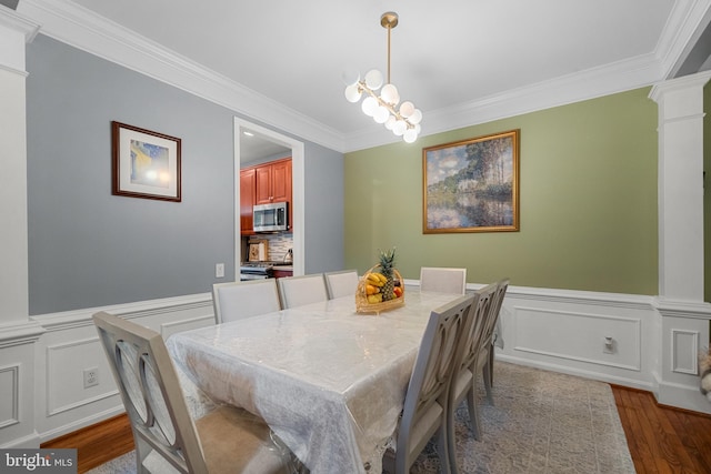 4000 Timber Oak Trl, Fairfax, VA 22033 - dining area featuring crown molding, decorative columns, dark wood-style floors, a wainscoted wall, and a decorative wall