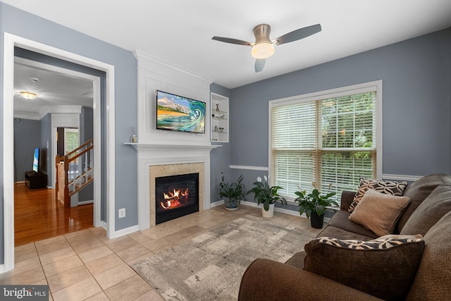 4000 Timber Oak Trl, Fairfax, VA 22033 - living room featuring plenty of natural light, a ceiling fan, a tiled fireplace, light tile patterned floors, and crown molding