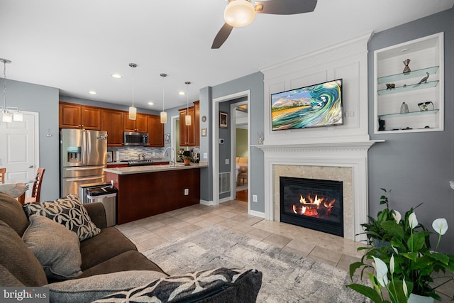 4000 Timber Oak Trl, Fairfax, VA 22033 - living room featuring ceiling fan, a fireplace, light tile patterned floors, recessed lighting, and baseboards