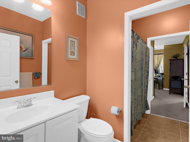 900 Marshy Cv Unit 111, Cambridge, MD 21613 - full bathroom featuring toilet, vanity, tile patterned floors, and baseboards