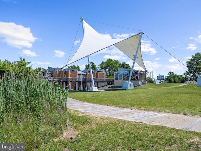 900 Marshy Cv Unit 111, Cambridge, MD 21613 - surrounding community featuring a lawn, a boat dock, and boat lift