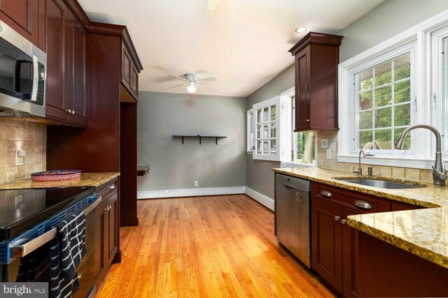 2410 Huntingdon Rd, Huntingdon Valley, PA 19006 - kitchen with appliances with stainless steel finishes, a ceiling fan, a sink, baseboards, and light wood-style flooring