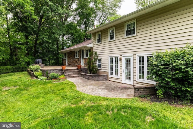 2410 Huntingdon Rd, Huntingdon Valley, PA 19006 - rear view of property with a patio area and a lawn