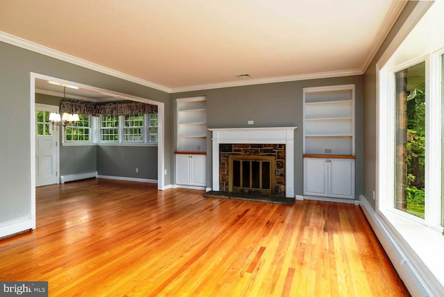 2410 Huntingdon Rd, Huntingdon Valley, PA 19006 - unfurnished living room featuring a baseboard heating unit, wood finished floors, crown molding, built in features, and a fireplace