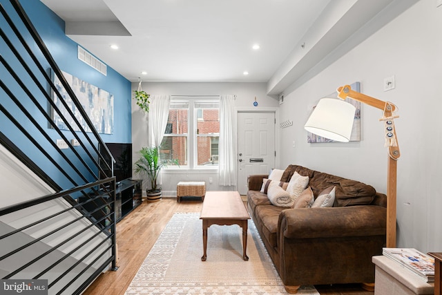 2117 Latona St, Philadelphia, PA 19146 - living room featuring wood finished floors, stairs, and recessed lighting