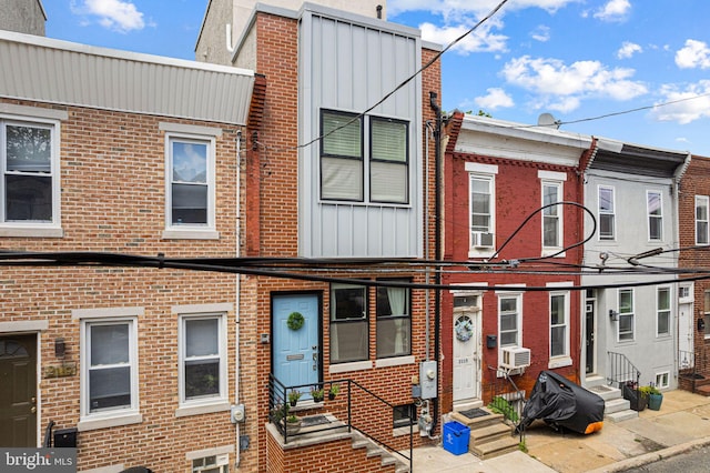 2117 Latona St, Philadelphia, PA 19146 - view of property featuring entry steps, cooling unit, and brick siding