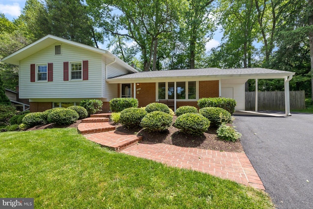 1515 Ainsley Rd, Silver Spring, MD 20904 - tri-level home with driveway, an attached carport, and brick siding