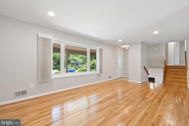 1515 Ainsley Rd, Silver Spring, MD 20904 - unfurnished living room with wood finished floors, baseboards, recessed lighting, and stairs