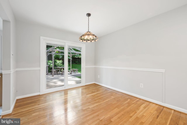 1515 Ainsley Rd, Silver Spring, MD 20904 - empty room with baseboards, light wood-type flooring, and a chandelier