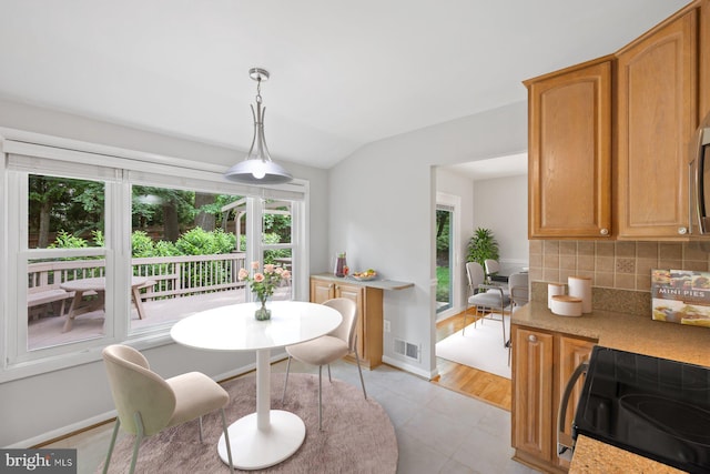 1515 Ainsley Rd, Silver Spring, MD 20904 - dining area featuring vaulted ceiling and baseboards