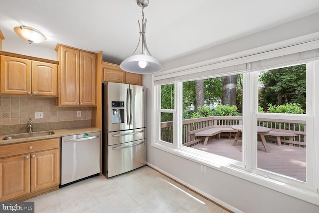 1515 Ainsley Rd, Silver Spring, MD 20904 - kitchen featuring appliances with stainless steel finishes, a sink, backsplash, baseboards, and hanging light fixtures