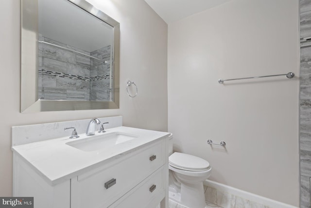 1515 Ainsley Rd, Silver Spring, MD 20904 - bathroom with vanity, toilet, marble look tile flooring, baseboards, and tiled shower