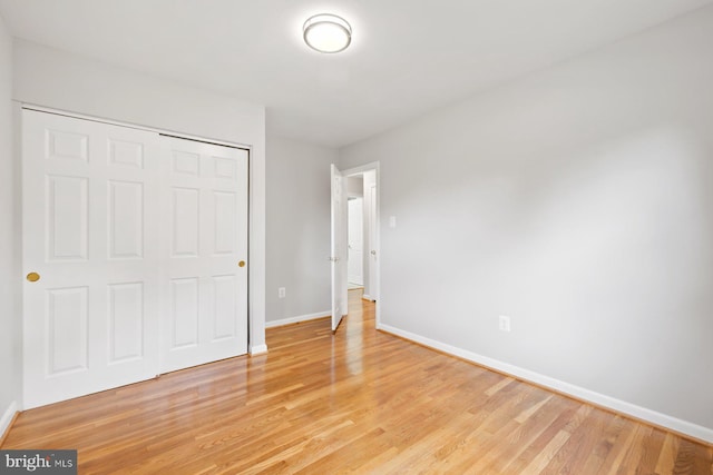 1515 Ainsley Rd, Silver Spring, MD 20904 - unfurnished bedroom with baseboards, light wood-type flooring, and a closet