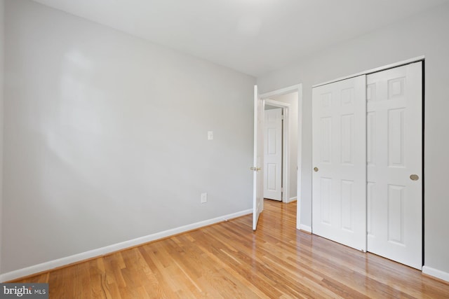 1515 Ainsley Rd, Silver Spring, MD 20904 - unfurnished bedroom with baseboards, light wood-style flooring, and a closet