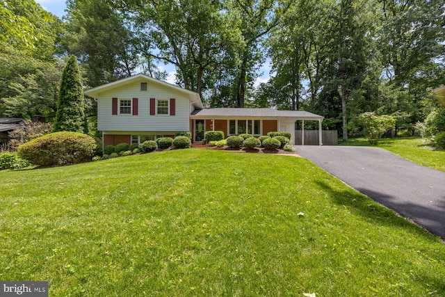 1515 Ainsley Rd, Silver Spring, MD 20904 - split level home with driveway, a front lawn, and an attached carport