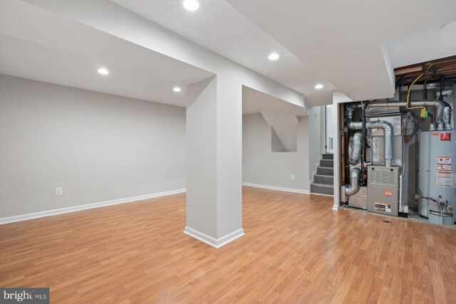 1515 Ainsley Rd, Silver Spring, MD 20904 - finished basement featuring gas water heater, light wood-type flooring, stairway, baseboards, and recessed lighting
