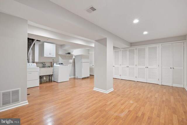 1515 Ainsley Rd, Silver Spring, MD 20904 - finished below grade area featuring washer / clothes dryer, freestanding refrigerator, light wood-style floors, and recessed lighting