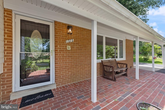 1515 Ainsley Rd, Silver Spring, MD 20904 - view of exterior entry featuring covered porch and brick siding