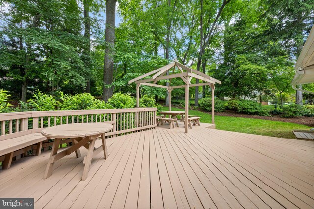 1515 Ainsley Rd, Silver Spring, MD 20904 - deck featuring a gazebo, outdoor dining area, and view of wooded area