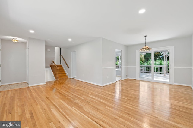 1515 Ainsley Rd, Silver Spring, MD 20904 - unfurnished living room featuring light wood-style flooring, stairway, recessed lighting, and baseboards