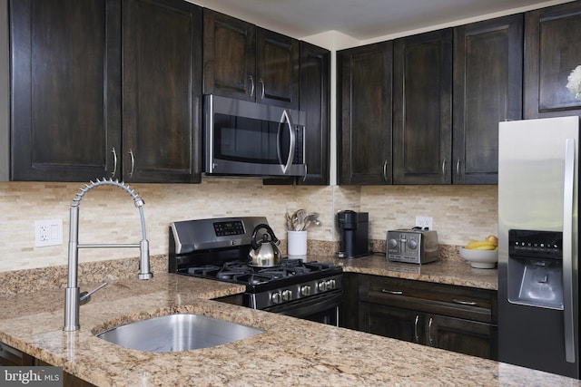 10893 Deborah Dr, Potomac, MD 20854 - kitchen with stainless steel appliances, a sink, light stone countertops, and backsplash