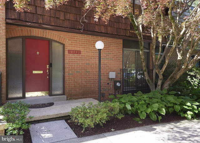 10893 Deborah Dr, Potomac, MD 20854 - doorway to property featuring brick siding