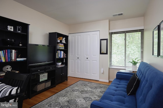 10893 Deborah Dr, Potomac, MD 20854 - living area with wood finished floors, plenty of natural light, and baseboards