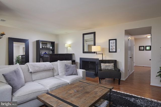 10893 Deborah Dr, Potomac, MD 20854 - living area featuring wood finished floors, baseboards, and a fireplace