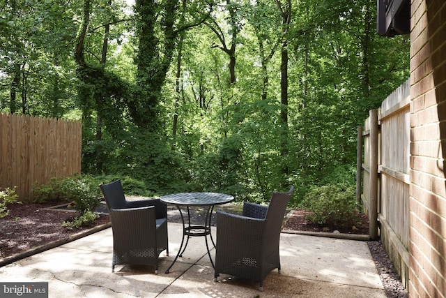 10893 Deborah Dr, Potomac, MD 20854 - view of patio / terrace featuring outdoor dining space and a view of trees
