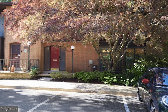 10893 Deborah Dr, Potomac, MD 20854 - view of front facade with uncovered parking and brick siding