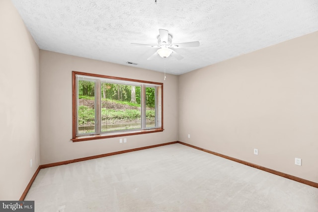 23140 Cobblestone Ln Unit 109, California, MD 20619 - spare room with ceiling fan, baseboards, carpet floors, and a textured ceiling