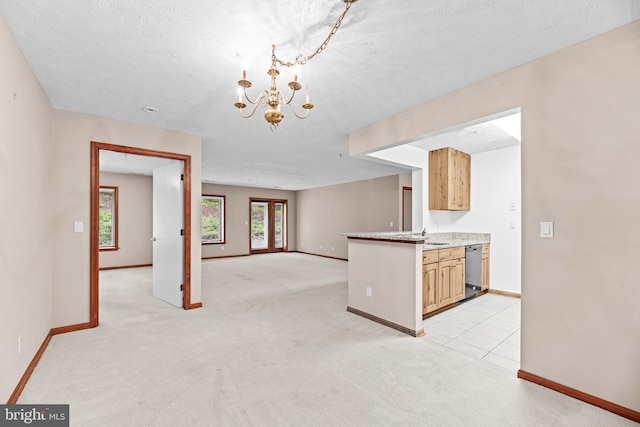 23140 Cobblestone Ln Unit 109, California, MD 20619 - kitchen featuring baseboards, dishwasher, a textured ceiling, a chandelier, and light colored carpet